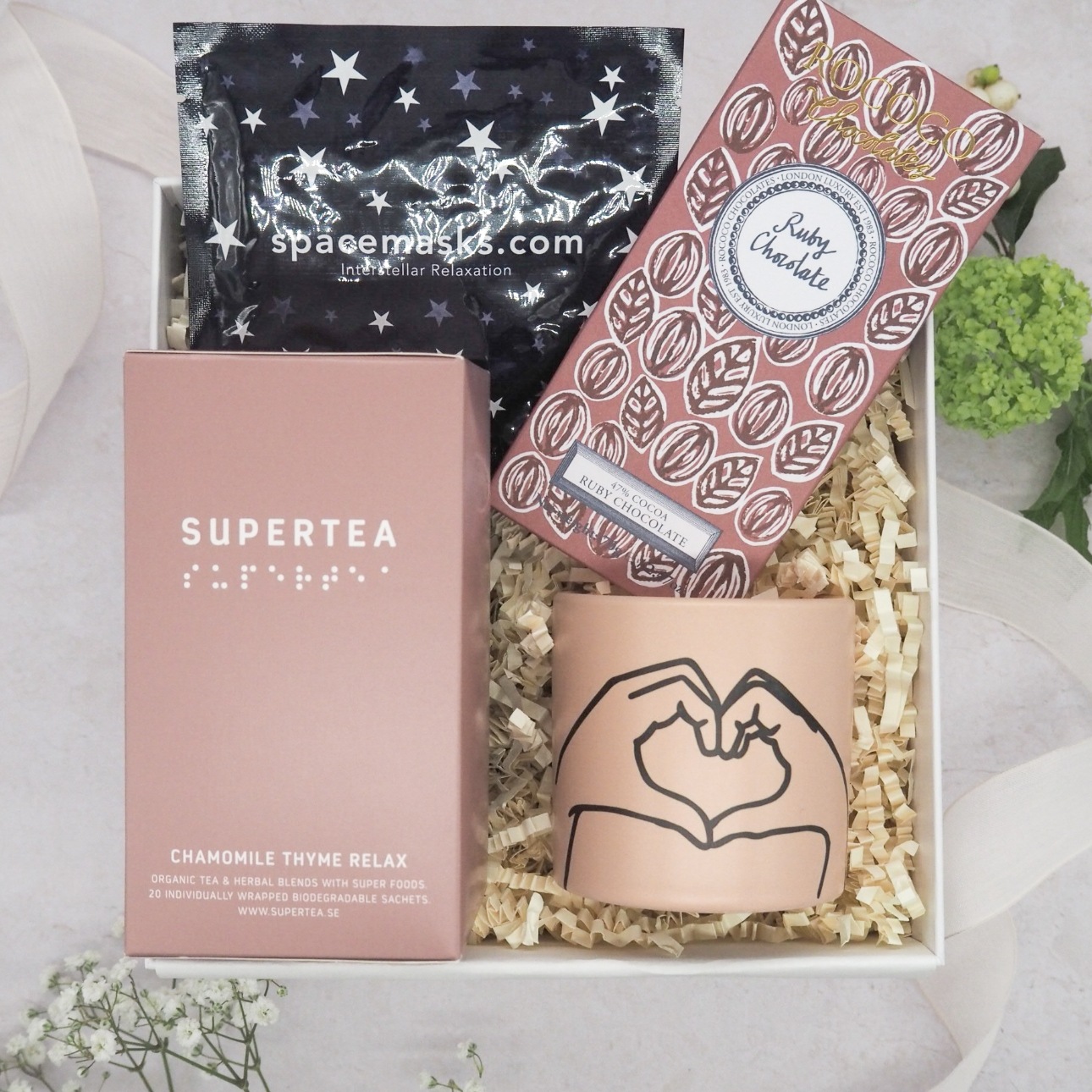 gift box with mug, tea, chocs, and face mask