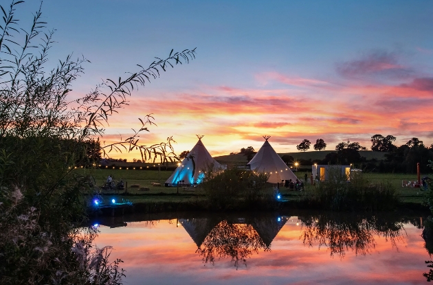 Tipis at sunset at Alcott Weddings in Worcestershire