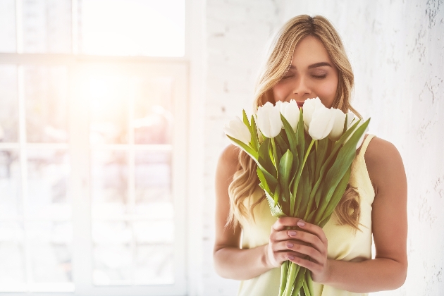 bride holding bouquet of white tulips