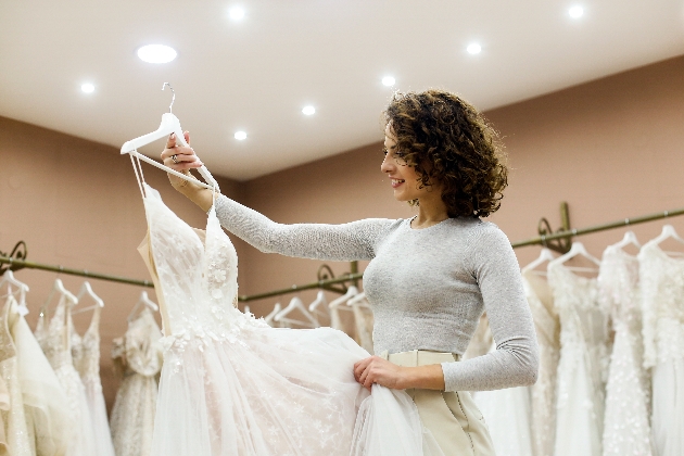 Woman looking at a wedding dress