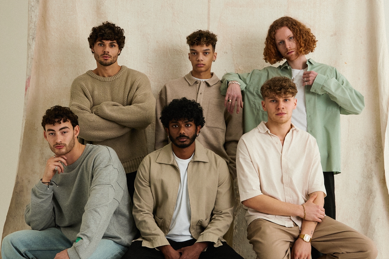 group of six models all with curly hair