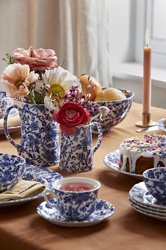 Blue and white crockery with flowers and candles